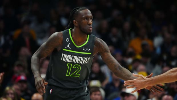 Timberwolves forward Taurean Prince high-fives a teammate.